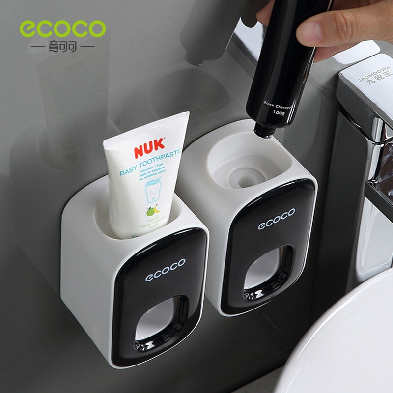 Automatic Toothbrush Holder Dispenser mounted on a bathroom wall